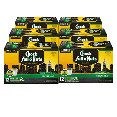 Six boxes of Chock full o'Nuts Midtown Decaf - Keurig K-Cup® Pods - Medium, adorned with city skyline imagery. Each box includes 12 recyclable pods made from premium Arabica coffee, offering a delightful decaf experience.