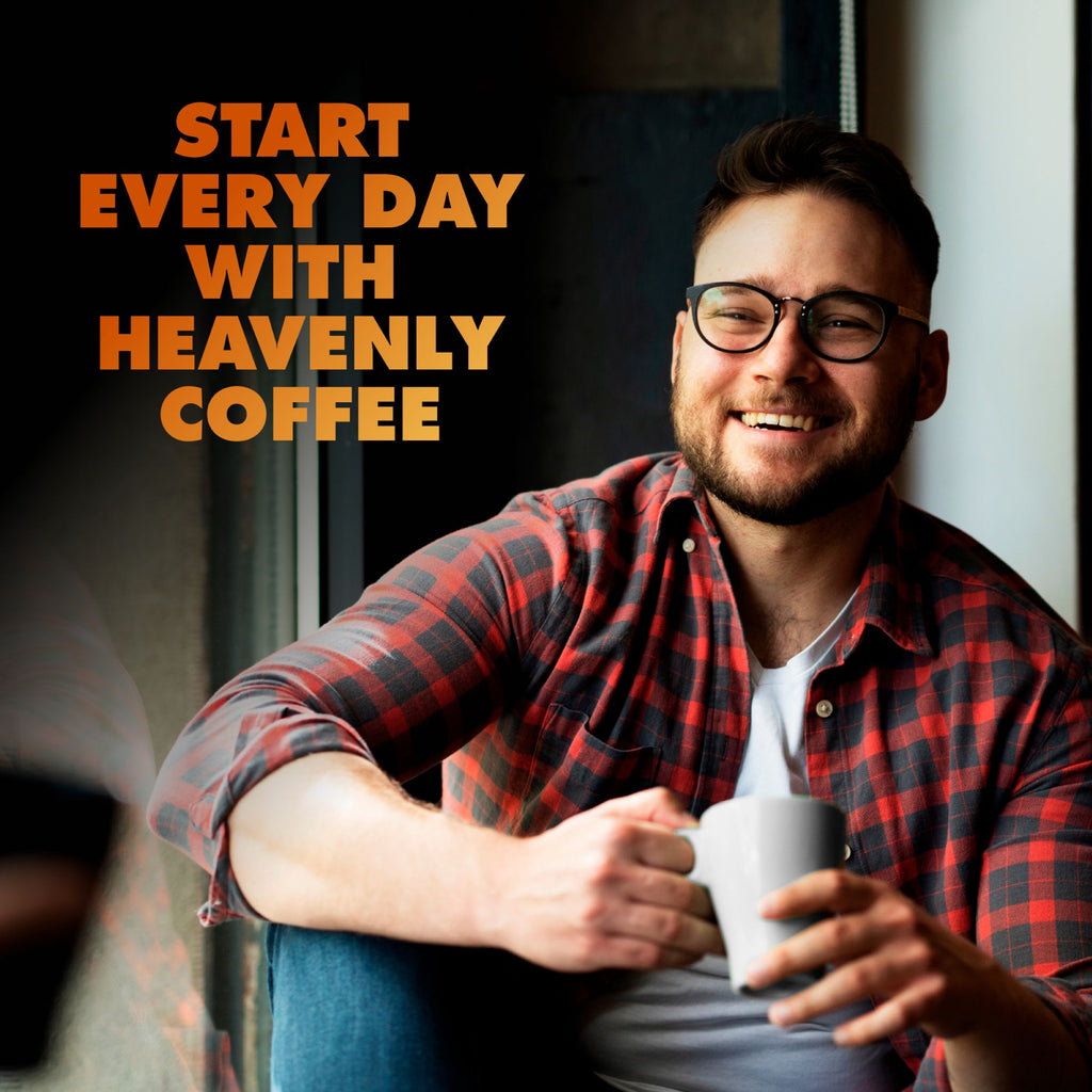 A man in glasses and a plaid shirt smiles by a window, holding a white mug. Text reads, "Begin your day with Chock full o’Nuts Donut Shop K-Cup® Pods—premium medium roast Arabica coffee.