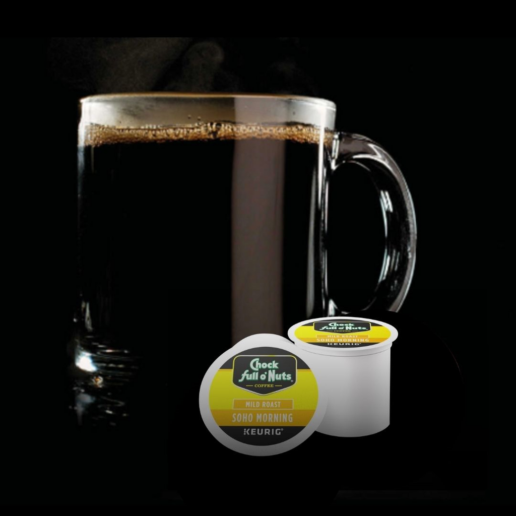 A clear mug filled with black coffee is placed next to two Chock full o'Nuts Soho Morning - Keurig K-Cup® Pods, showcasing the mild roast premium Arabica blend against a sleek black background.